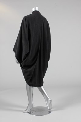 Lot 315 - An Issey Miyake charcoal grey wool cocoon coat,...