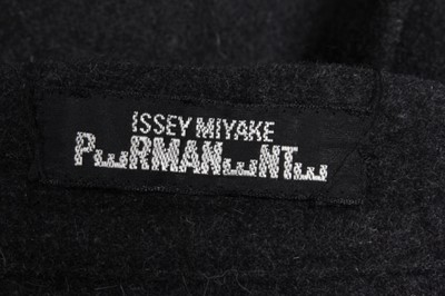 Lot 315 - An Issey Miyake charcoal grey wool cocoon coat,...