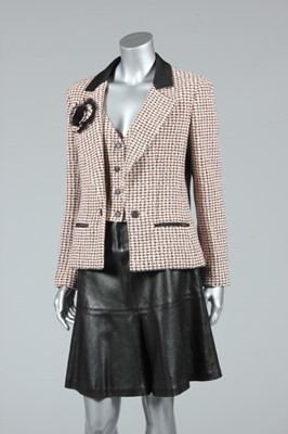 Lot 155 - A Chanel boutique pink and black tweed jacket...