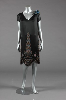 Lot 368 - A black satin flapper dress, circa 1926, of...