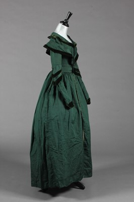 Lot 375 - A bottle green silk pelisse robe, late...