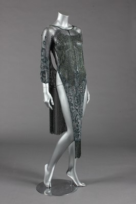 Lot 400 - An elaborately beaded black tulle tunic, late...