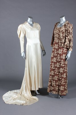 Lot 406 - The bias-cut ivory satin bridal gown and brown...