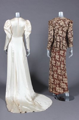 Lot 406 - The bias-cut ivory satin bridal gown and brown...