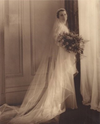 Lot 406 - The bias-cut ivory satin bridal gown and brown...
