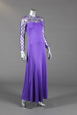 Lot 425 - A Loris Azzaro purple jersey evening gown and...