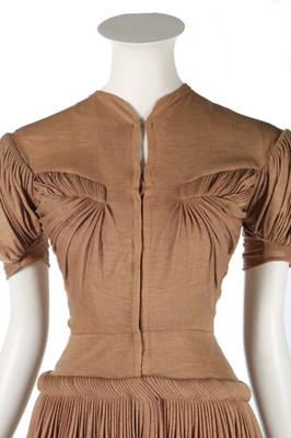 Lot 129 - A Madame Grès couture brown wool dinner dress,...