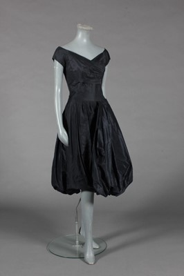 Lot 448 - Little black dresses, 1950s-early 60s,...