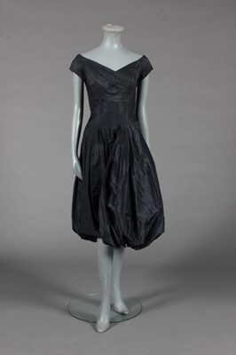 Lot 448 - Little black dresses, 1950s-early 60s,...