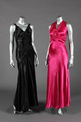 Lot 451 - Two slinky bias-cut satin evening gowns, mid...