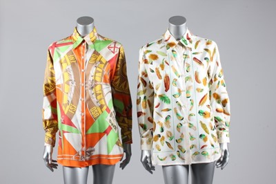 Lot 41 - Two Hermès printed silk shirts, 1980s,...