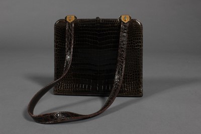 Lot 414 - Two crocodile handbags, circa 1960, crocodylus...