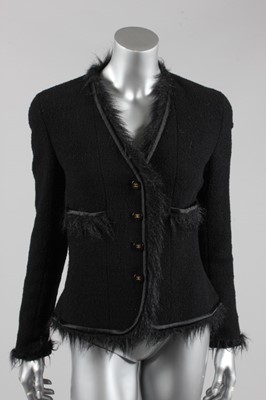 Lot 63 - A Chanel black boucl wool jacket, 1990s,...