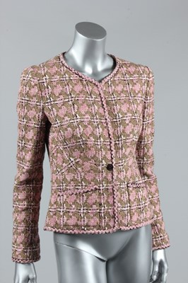 Lot 64 - A Chanel pink tweed jacket, 1990s, boutique...