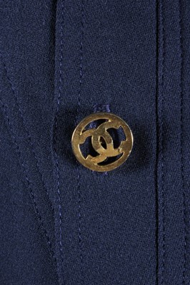 Lot 94 - A Chanel navy crepe suit, late 80s-early 90s,...