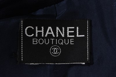 Lot 94 - A Chanel navy crepe suit, late 80s-early 90s,...