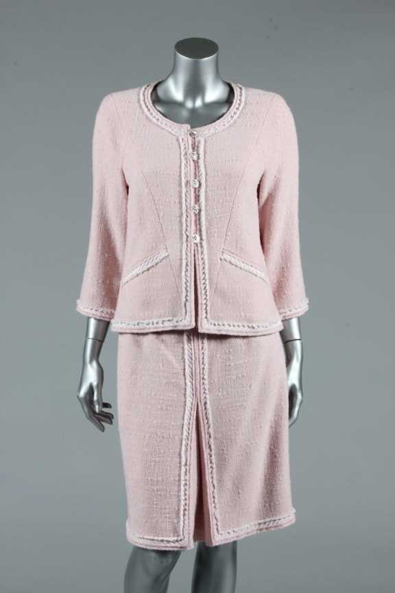 Lot 17 - A Chanel pink wool suit, circa 2010, boutique...