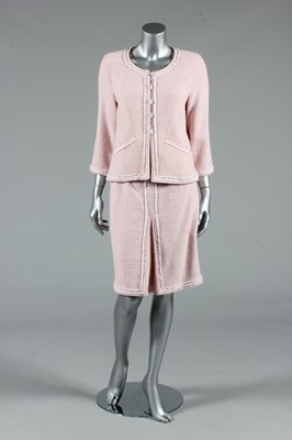 Lot 17 - A Chanel pink wool suit, circa 2010, boutique...