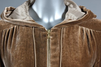 Lot 37 - A Betty Jackson gold velvet 'cagoule', worn in...