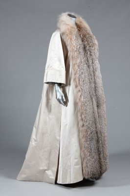 Lot 124 - A Christian Dior ivory satin and fur-trimmed...