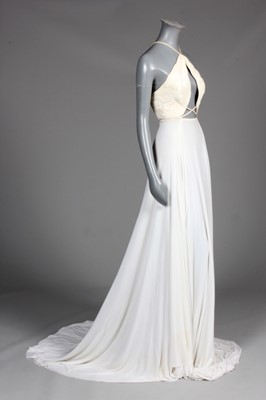 Lot 193 - A Madame Grès ivory jersey evening gown,...