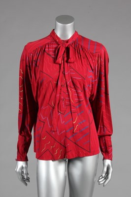 Lot 166 - A Jean Muir cherry-red printed jersey blouse,...