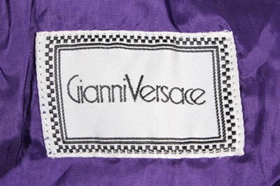 Lot 262 - A Gianni Versace purple suede bolero jacket,...