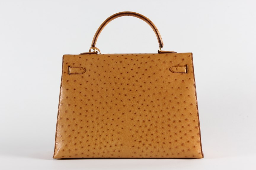 Lot 12 - An Hermès golden-brown ostrich Kelly bag