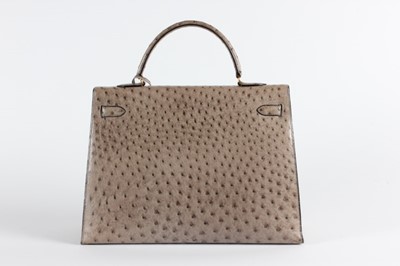 Lot 7 - An Hermès grey-brown ostrich leather Kelly bag,...