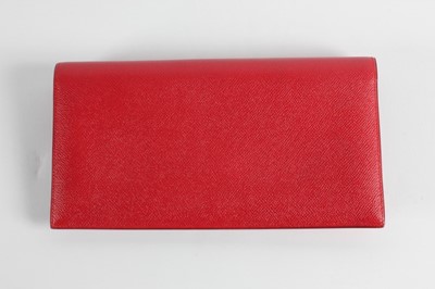 Lot 23 - An Hermès red epsom leather clutch bag, 1992,...
