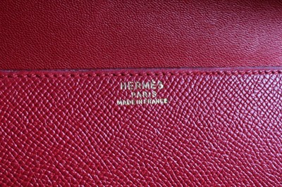 Lot 23 - An Hermès red epsom leather clutch bag, 1992,...