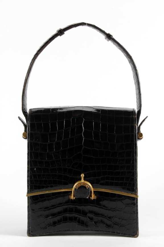 Lot 20 - A rare 'Eperon' Hermès black crocodile handbag,...