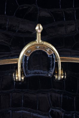 Lot 20 - A rare 'Eperon' Hermès black crocodile handbag,...