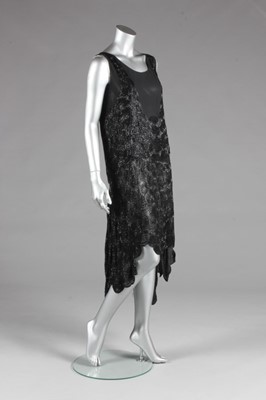 Lot 75 - A black beaded flapper dress, circa 1929, with...