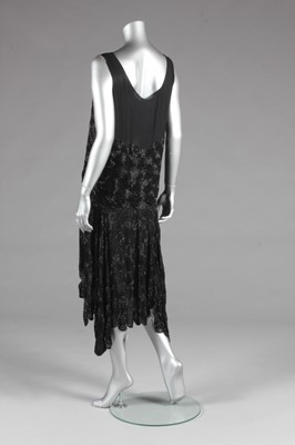 Lot 75 - A black beaded flapper dress, circa 1929, with...