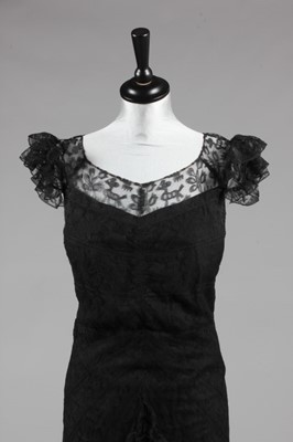Lot 90 - A Gabrielle Chanel black lace evening gown,...