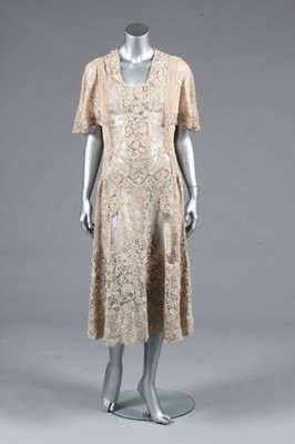 Lot 84 - A 1930s summer gown formed of Edwardian lace,...