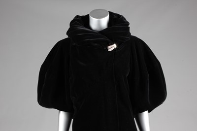 Lot 82 - A Madeleine Vionnet black velvet evening coat,...