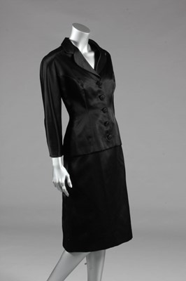 Lot 96 - A Balenciaga couture black satin cocktail suit,...