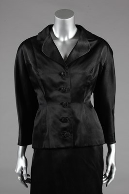 Lot 96 - A Balenciaga couture black satin cocktail suit,...