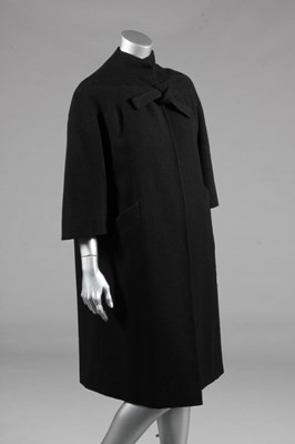 Lot 104 - A Pierre Balmain couture black wool coat, late...