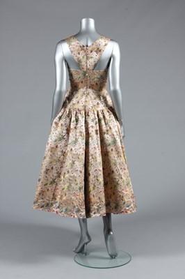 Lot 112 - A Jacques Heim couture oriental brocaded satin...