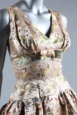 Lot 112 - A Jacques Heim couture oriental brocaded satin...