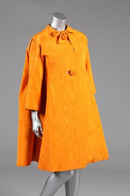 Lot 105 - A Nina Ricci orange moiré evening coat, late...