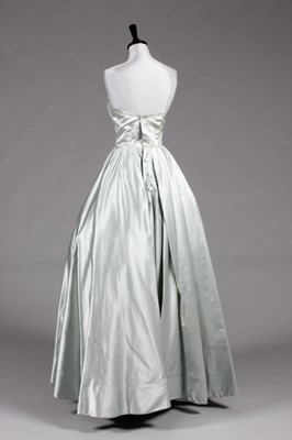 Lot 102 - A Jacques Fath couture ice-blue satin ball...