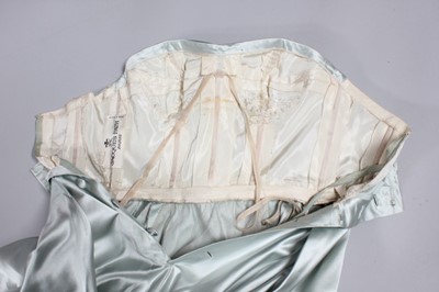 Lot 102 - A Jacques Fath couture ice-blue satin ball...