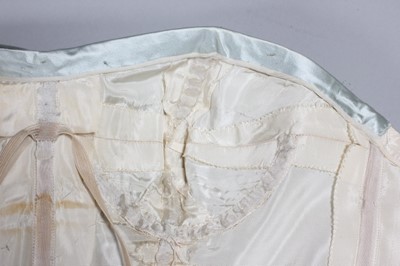 Lot 102 - A Jacques Fath couture ice-blue satin ball...