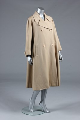 Lot 128 - A Balenciaga couture beige gabardine raincoat,...
