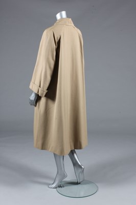 Lot 128 - A Balenciaga couture beige gabardine raincoat,...