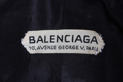 Lot 128 - A Balenciaga couture beige gabardine raincoat,...